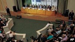 International observers from the Organization for European Security and Cooperation give a press briefing in Kyiv, Ukraine, May 26, 2014. 