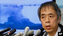 FILE - Japan's Meteorological Agency Volcanology Division Director Sadayuki Kitagawa speaks during a news conference on the eruption of Mount Aso.