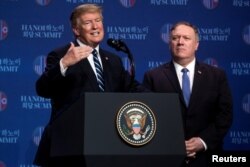 U.S. President Donald Trump accompanied by U.S. Secretary of State Mike Pompeo speaks at a news conference at the JW Marriott Hanoi, following talks with North Korean leader Kim Jong Un in Hanoi, Vietnam, Feb. 28, 2019.