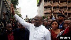 FILE - Felix Tshisekedi, leader of the Congolese main opposition party, the Union for Democracy and Social Progress (UDPS) who was announced as the winner of the presidential elections gestures to his supporters in Kinshasa, Democratic Republic of Congo, Jan. 10