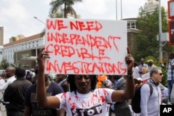 FILE - Kenyans human rights activists, lawyers and others hold a peaceful protest in Nairobi, July 4, 2016, against alleged pervasive killings and disappearances linked to police.