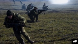 Pro-Russian rebels are seen conducting exercises near Yenakiyeve in the Donetsk region of eastern Ukraine March 11, 2015.
