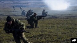 Pro-Russian rebels are seen conducting exercises near Yenakiyeve in the Donetsk region of eastern Ukraine March 11, 2015.