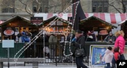 FILE - An 8½-foot-tall letter "A," which stands for atheist or agnostic, erected by the Wisconsin-based Freedom From Religion Foundation, is on display at the annual Christmas market in Chicago's Daley Plaza, Dec. 10, 2013.