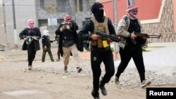 Iraqi tribal fighters who have been deployed onto the streets, patrol in the city of Fallujah, west of Baghdad Jan. 5, 2014. 