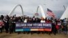 FILE - U.S. civil rights activists hold a Peace Walk on the Frederick Douglass Memorial Bridge to urge Democrats to pass a law protecting voting rights, during Martin Luther King Jr. Day, in Washington, Jan. 17, 2022.