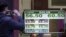 Currency exchange values are displayed on the buy-sell board of a bureau de exchange in Buenos Aires, Aug. 14, 2019.