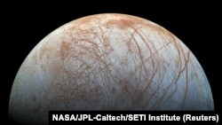 FILE - Jupiter's moon Europa is seen as created from images taken by NASA's Galileo spacecraft in the late 1990s, according to NASA, and obtained by Reuters, May 14, 2018.
