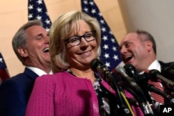 Rep. Liz Cheney, R-Wy., center, speaks during a news conference on Capitol Hill in Washington, Nov. 14, 2018, following a meeting for the House Republican leadership elections. Behind her are new House Minority Leader Kevin McCarthy of California, left, and Rep. Steve Scalise of Louisiana, who will remain House GOP whip. Cheney was elected chairwoman of the House Republican Conference, the No. 3 position in leadership.