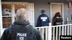 U.S. Immigration and Customs Enforcement officers conduct a targeted enforcement operation in Atlanta, Georgia, Feb. 9, 2017. 