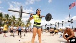 CrossFit is not just for the boys. CrossFit trainer Daniella Estrella competes in Miami Beach, Florida for a grand prize of $21 thousand dollars. (Oct. 2013)