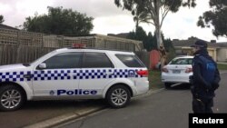 FILE - Australian police search what is believed to be the home of gunman Yacqub Khayre, who was shot dead by police on Monday after he shot a man dead and held a woman hostage, in the Melbourne suburb of Roxburgh Park in Australia, June 6, 2017. 
