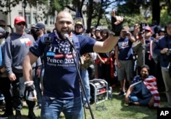 FILE - Joey Gibson speaks during a rally in support of free speech April 27, 2017, in Berkeley, California.