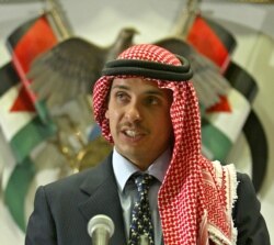 FILE - Prince Hamza bin Hussein delivers a speech to Muslim clerics and scholars at the opening ceremony of a religious conference at the Islamic Al al-Bayet University in Amman, Jordan, Aug. 21, 2004.
