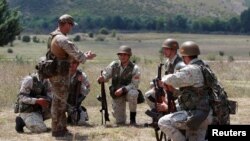 Macedonian military academy graduates train for their final infantry platoon leader exam under the supervision of British Military Advisory Training Team, to ensure accordance with NATO regulations, at Krivolak Army base, Macedonia, July 10, 2018. 