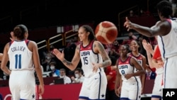 United States's Brittney Griner (15), center, and teammates celebrate after their win in the women's basketball gold medal game against Japan at the 2020 Summer Olympics, Sunday, Aug. 8, 2021, in Saitama, Japan. (AP Photo/Eric Gay)