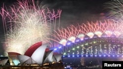 FILE - Fireworks are seen over the Sydney Opera House and Harbor Bridge during New Year's Eve celebrations in Sydney, Australia, January 1, 2024