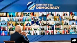 President Joe Biden speaks from the South Court Auditorium on the White House complex in Washington, Thursday, Dec. 9, 2021, for the opening of the Democracy Summit.