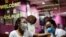 Therapists wearing face shields wait for costumers at a traditional Thai massage shop which reopened after the Thai government eased isolation measures to prevent the spread of the coronavirus disease (COVID-19) in Bangkok, Thailand, June 3, 2020. REUTERS