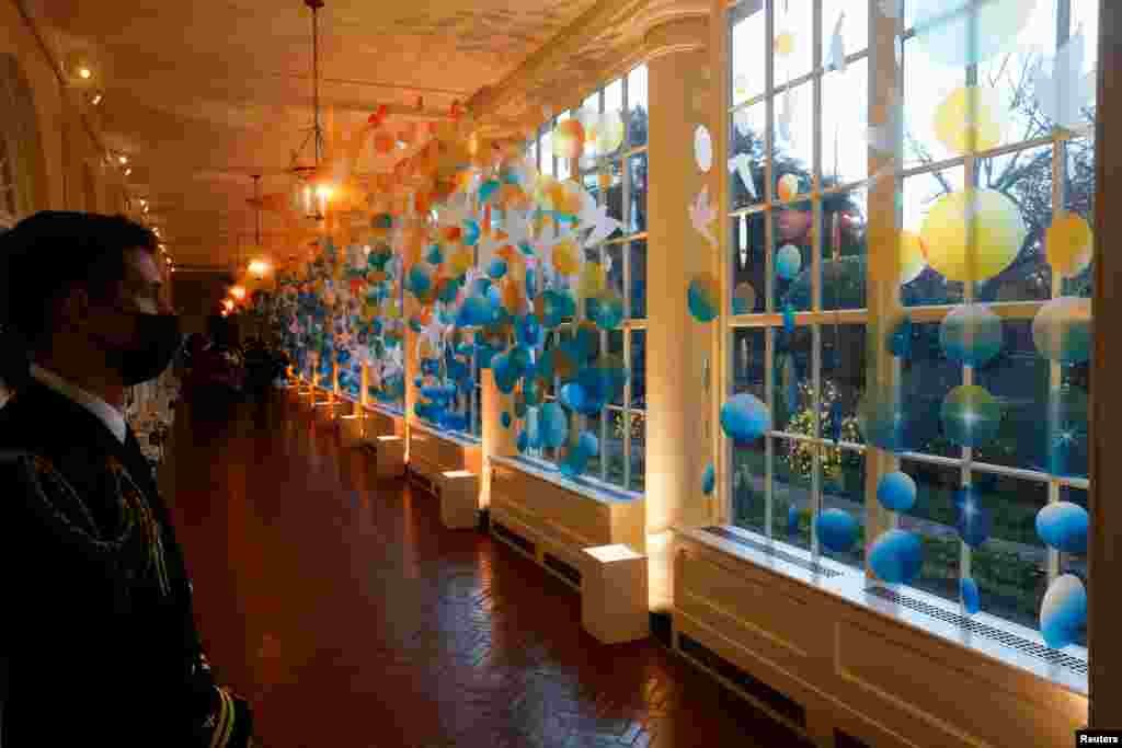 Doves and shooting stars decorate the East Colonnade of the White House during a press tour of Christmas decorations ahead of holiday receptions by U.S. President Joe Biden and first lady Jill Biden in Washington, U.S. November 29, 2021. REUTERS/Jonathan Ernst