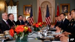 Secretary of Defense Jim Mattis (L) Secretary of State Mike Pompeo (2nd-L), Chinese Politburo Member Yang Jiechi (3rd-R), and Chinese State Councilor and Defense Minister General Wei Fenghe (2nd-R) meet at the State Department in Washington, Nov. 9, 2018.
