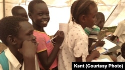 Displaced South Sudanese children attend class inside a tent set up by UNICEF in Mingkaman, in Lakes state. The schooling of the vast majority of children displaced by months of fighting in South Sudan has been interrupted. 