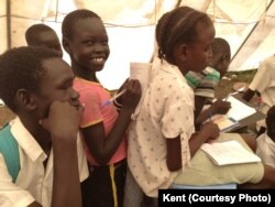 FILE - Displaced South Sudanese children attend class inside a tent set up by UNICEF in Mingkaman, in Lakes State, May 6, 2019.