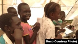 FILE - Displaced South Sudanese children attend class inside a tent set up by UNICEF in Mingkaman, in Lakes State. 