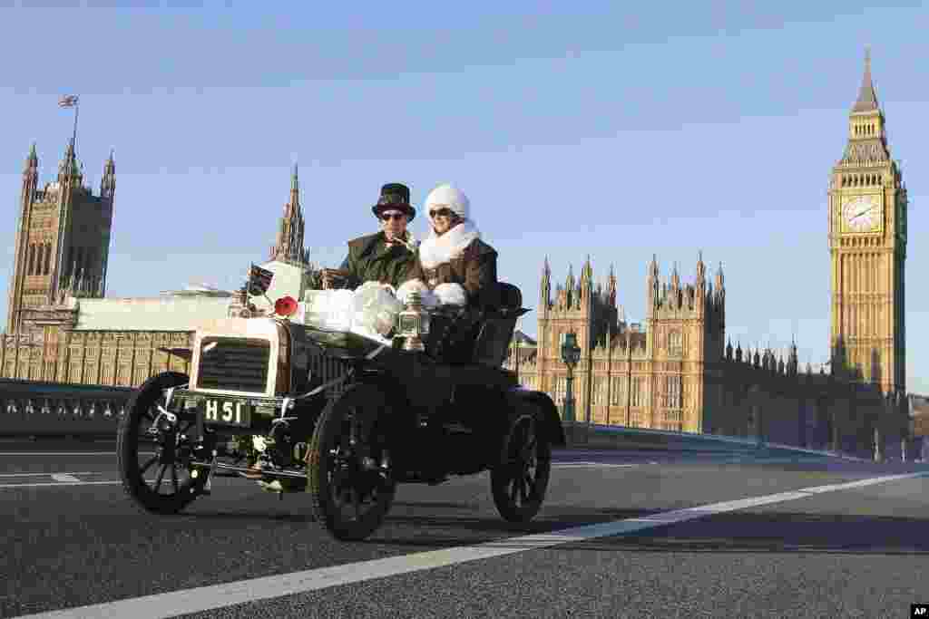 Participants drive their 1904 Swift over Westminster Bridge during the London to Brighton Veteran Car Run in London.