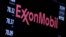 FILE - The logo of Exxon Mobil Corp. is shown on a monitor above the floor of the New York Stock Exchange in New York, Dec. 30, 2015. 