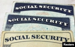 FILE PHOTO: U.S. Social Security card designs over the past several decades