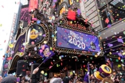 FILE - The "air worthiness" of confetti is tested by Planet Fitness, in partnership with Times Square Alliance, prior to Times Square's New Year's Eve 2020 celebration in New York City, Dec. 29, 2019.