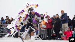 Tank Young, 14, performs at the Indigenous Peoples Day Sunrise Gathering, Oct. 14, 2024, in San Francisco. 