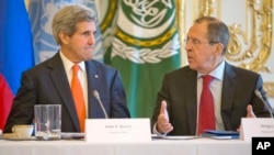 U.S. Secretary of State John Kerry, left, listens to Russia's Foreign Minister Sergey Lavrov before the start of their joint meeting with U.N.-Arab League envoy for Syria Lakhdar Brahimi at the U.S. ambassador's residence in Paris, France, Monday, Jan. 13, 2014. Kerry is in Paris for meetings on Syria to rally international support for ending the three-year civil war in Syria. (AP Photo/Pablo Martinez Monsivais, Pool)