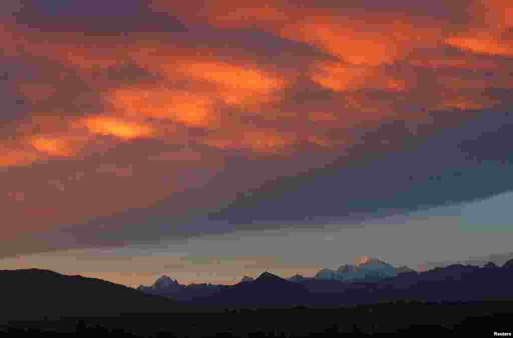 The Mont Blanc massif at sunrise is seen from Geneva, Switzerland.