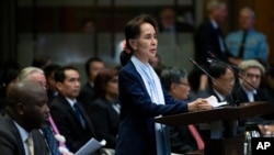 Myanmar's leader Aung San Suu Kyi addresses judges of the International Court of Justice on the second day of three days of hearings in The Hague, Netherlands, Dec. 11, 2019. 