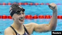 United States' Katie Ledecky celebrates winning the gold medal in the women's 200-meter freestyle at the 2016 Summer Olympics in Rio de Janeiro, Aug. 9, 2016.