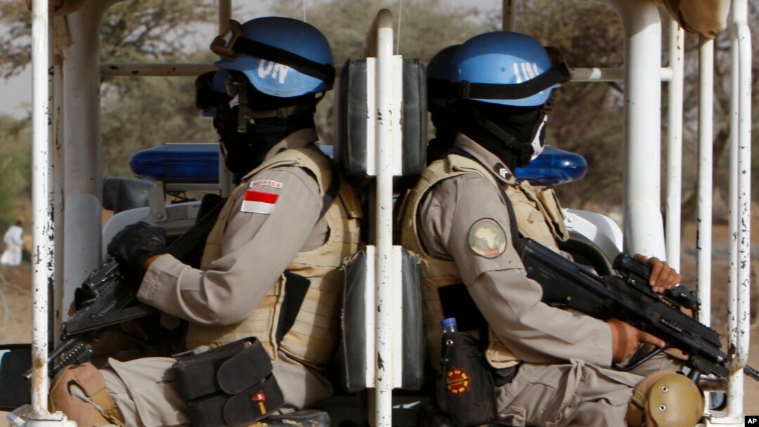 FILE - United Nations African Mission In Darfur, UNAMID peacekeepers patrol the refugee camp of Zamzam at the outskirts of the Darfur town of el Fasher, Sudan, April 13, 2010. 