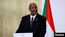 FILE: Sudan's Sovereign Council Chief General Abdel Fattah al-Burhan attends a news conference during a visit to Paris, France. 5.17.2021