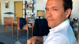 French Digital Affairs junior minister Cedric O demonstrates how to use the French app StopCovid meant to trace the virus' future spread on during an interview with the Associated Press in Paris, Friday, May 29, 2020.