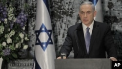 Israeli Prime Minister Benjamin Netanyahu speaks during a ceremony with Israeli President Reuven Rivlin, not shown, in Jerusalem, March 25, 2015.