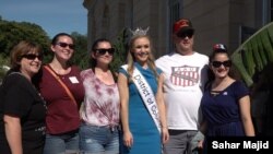 Miss DC 2019 Katelynn Cox posing with visitors at the U.S. Botanic Garden.