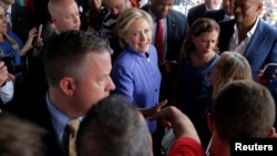 U.S. Democratic presidential candidate Hillary Clinton greets supporters outside a campaign rally in Wilton Manors, Florida, Oct. 30, 2016. News of additional emails the FBI uncovered from when she was secretary of state has apparently brought her polling numbers down.