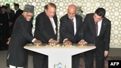 In this photograph released by the Press Information Bureau (PIB) on December 13, 2015, Indian Vice President, Hamid Ansari (L), along with President of Turkmenistan, Gurbanguly Berdimohamedov (R), President of Afghanistan, Ashraf Ghani (2R) and Prime Minister of Pakistan, Nawaz Sharif press the button to begin the welding process of the TAPI Gas Pipeline in Mary, capital of south eastern Mary province. 