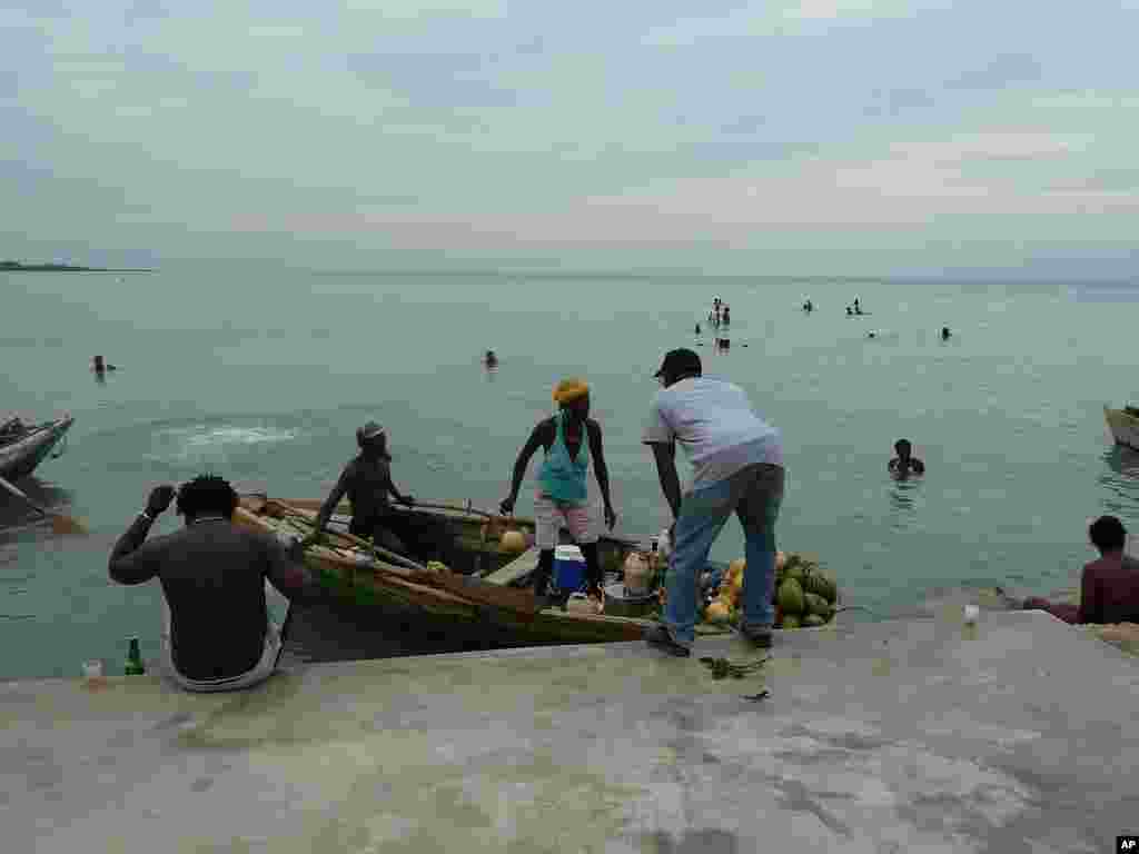 Vendor arrives at harbor near Leogane, Haiti