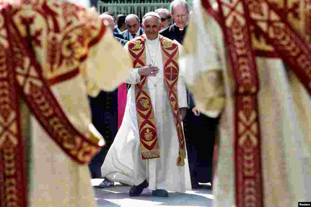 Pope Francis arrives to visit the Apostolic Cathedral in Etchmiadzin, Armenia. Francis denounced again the World War I-era mass killings of Armenians by Ottoman Turks as “genocide” as he met with Armenia’s President Serzh Sargsyan.