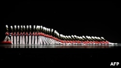 FILE - The Rockettes tumble down in the "Parade of the Wooden Soldiers" during the 2015 Radio City Christmas Spectacular at Radio City Music Hall December 2, 2015. (AFP PHOTO / TIMOTHY A. CLARY)