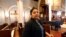 FILE - Amanda Morales seeks refuge in the sanctuary of the Holyrood Episcopal Church, northern Manhattan, Oct. 26, 2017.