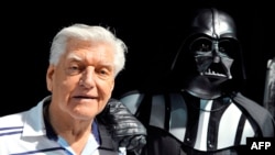 FILE - David Prowse, the British actor behind the menacing black mask of Star Wars villain Darth Vader, died at 85.