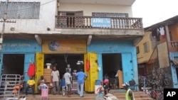 The Arwa clinic, center, that was closed after the clinic Doctor got infected by the Ebola virus in the capital city of Freetown, Sierra Leone, July 15, 2014..